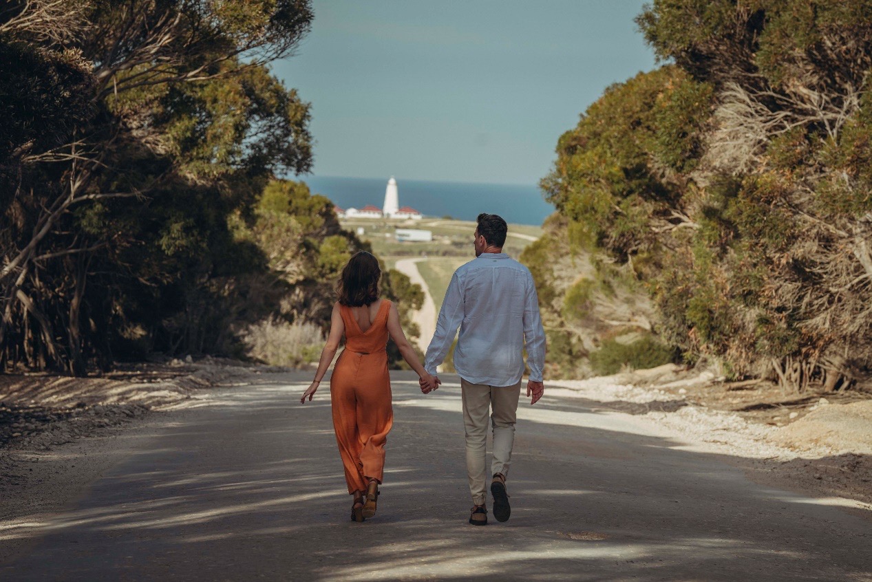 Two guests walking the road to Cape Willoughby lighthouse, Kangaroo Island