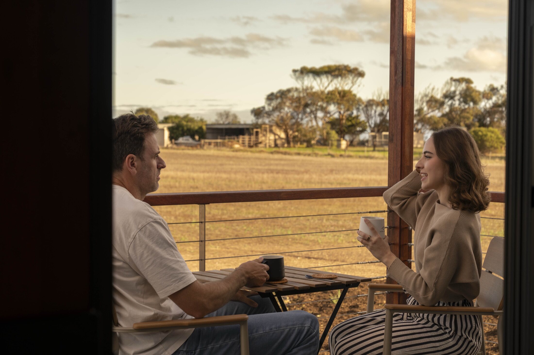 Morning coffee on the deck as the light comes up over the paddocks